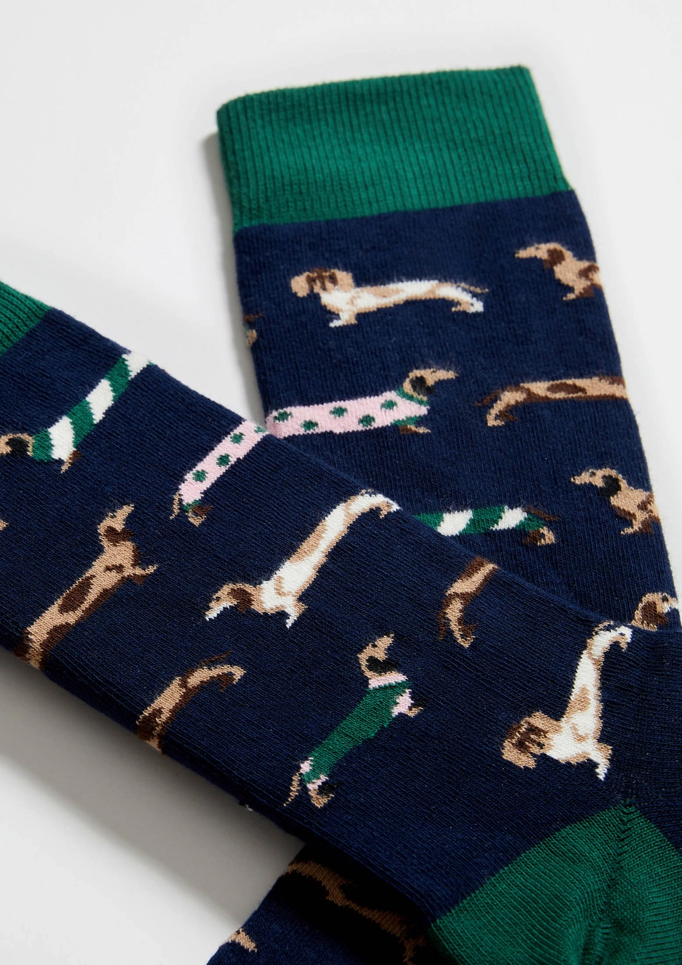 Sokid "Lemmik" 5 Tumesinised sokid, millel on kujutatud mustrilised taksikoerad